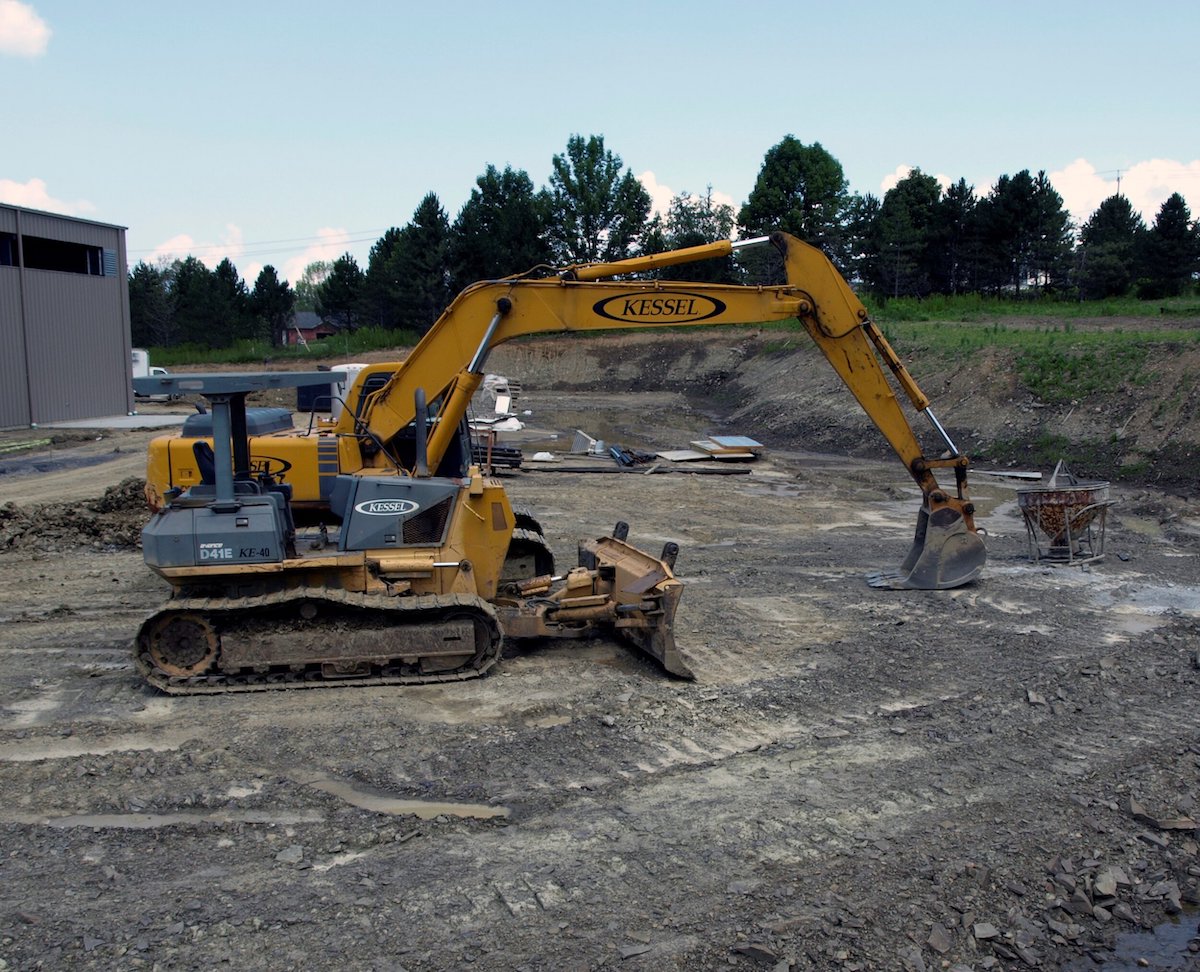 Excavator machine on a construction site.