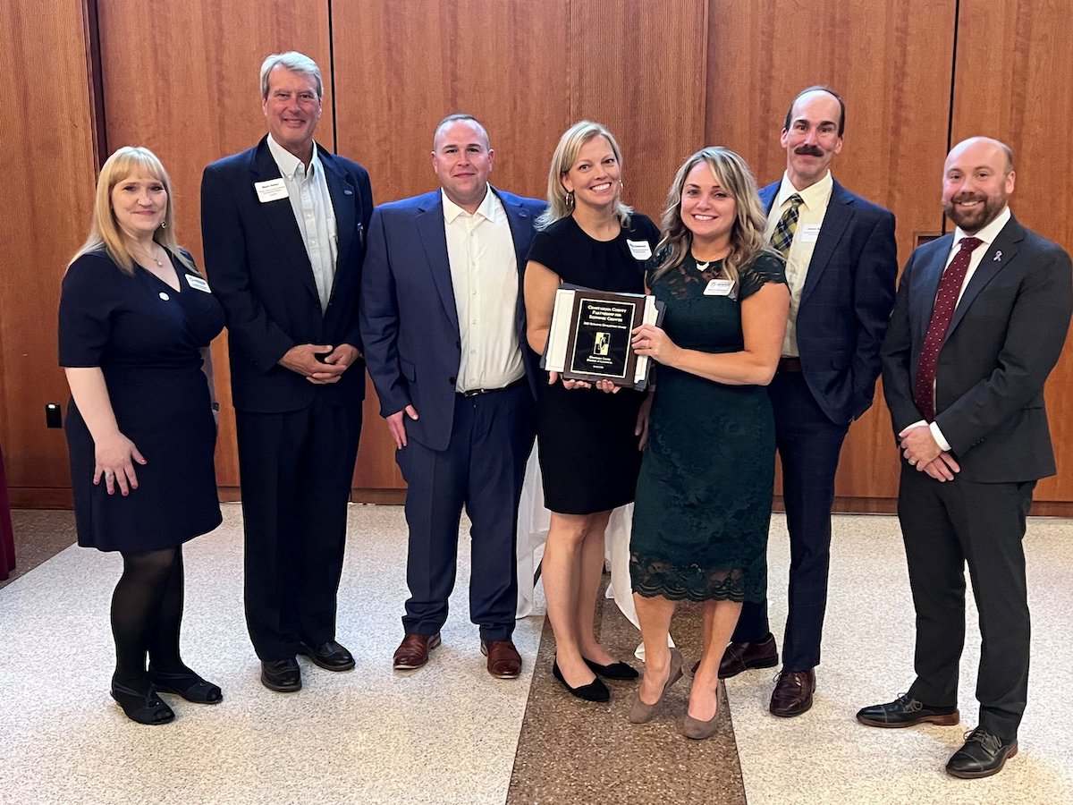 CCPEG team posing with an award.